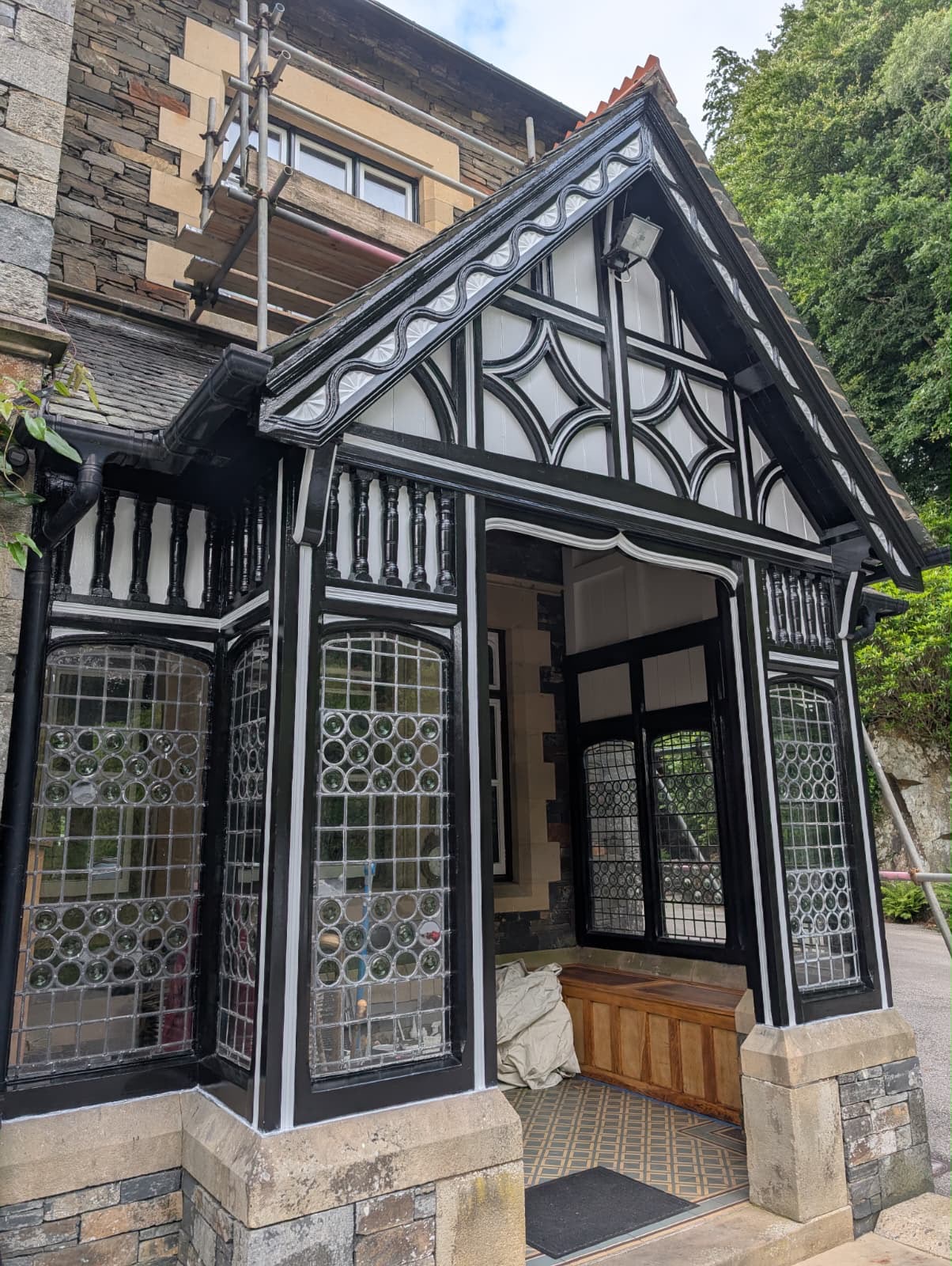 Fully restored ornate timber entrance porch in Troutbeck