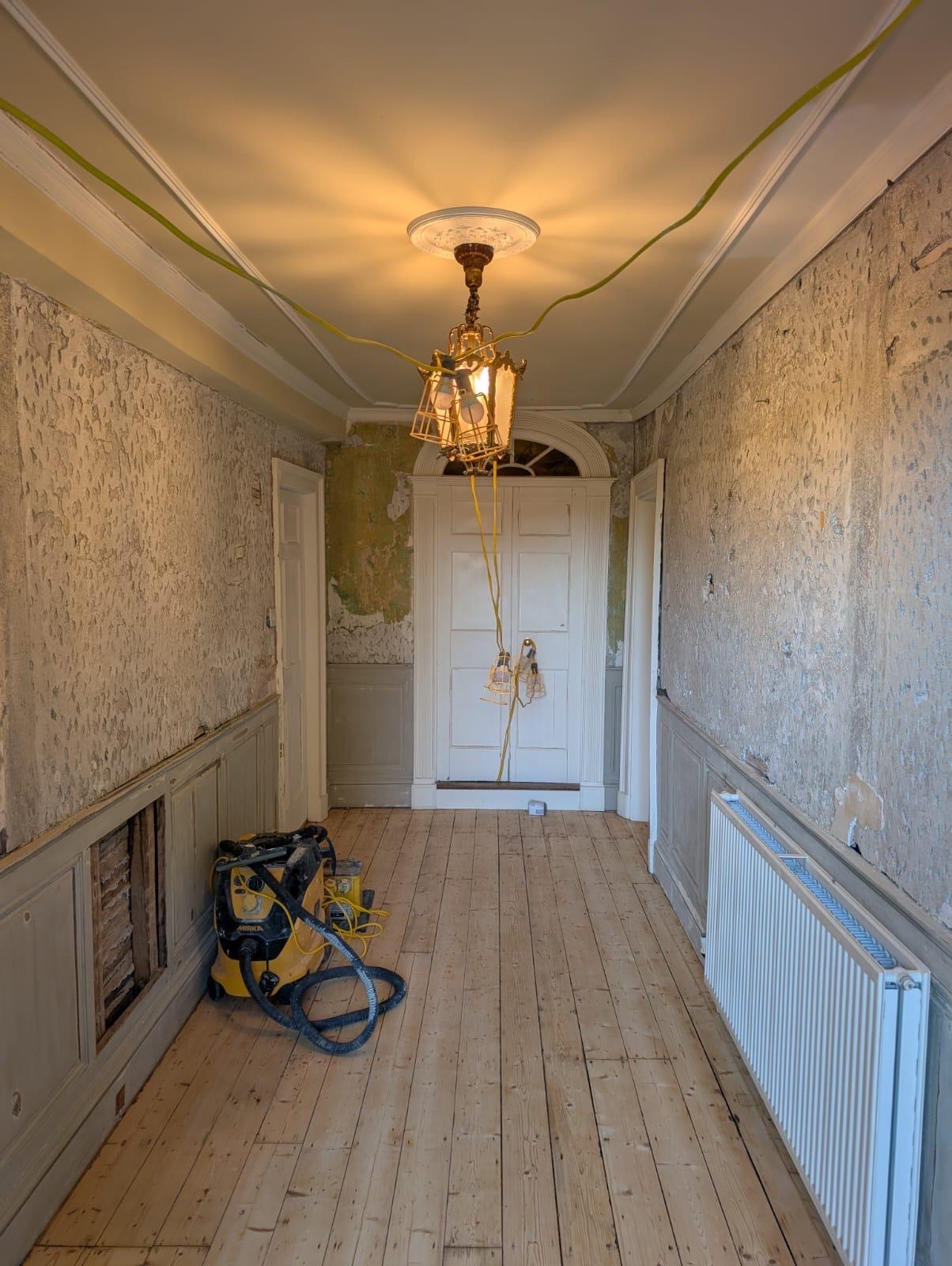 Hallway woodwork primed and painted